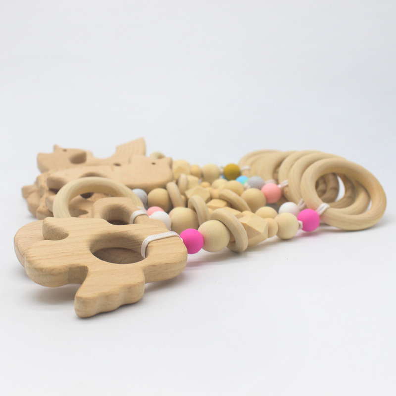 Suministros de bebé juguete de haya mordedor bebé Seguridad Protección del Medio Ambiente anillo de cuentas de silicona dientes molienda palo nuevo estilo