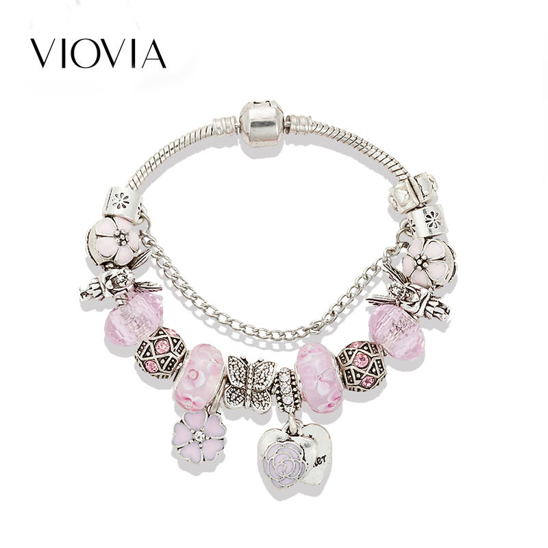 Bracciale di perline rosa con ciondolo a fiore e cuore_voghion.com