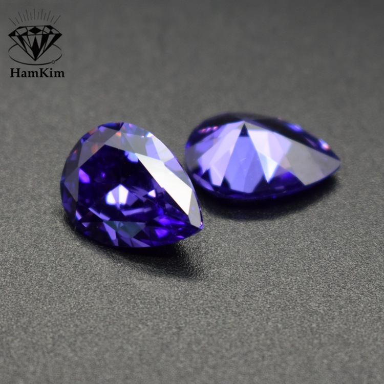 Blue gemstone drop-shaped with zircon