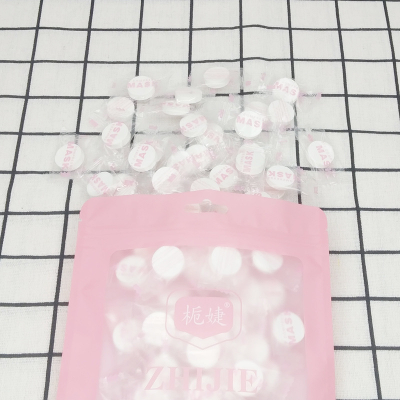 栀婕一次性压缩面膜纸 100粒糖果压缩纸膜 无纺布面膜扣膜布批发