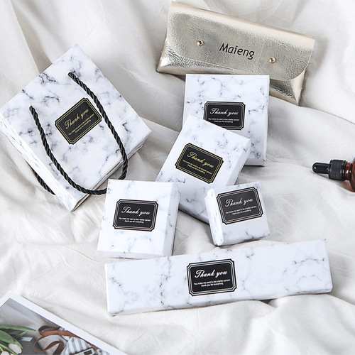 Batch wholesale marble jewelry box with top and bottom covers, rings, earrings, ear studs, bracelets, pearl necklaces, and accessories.