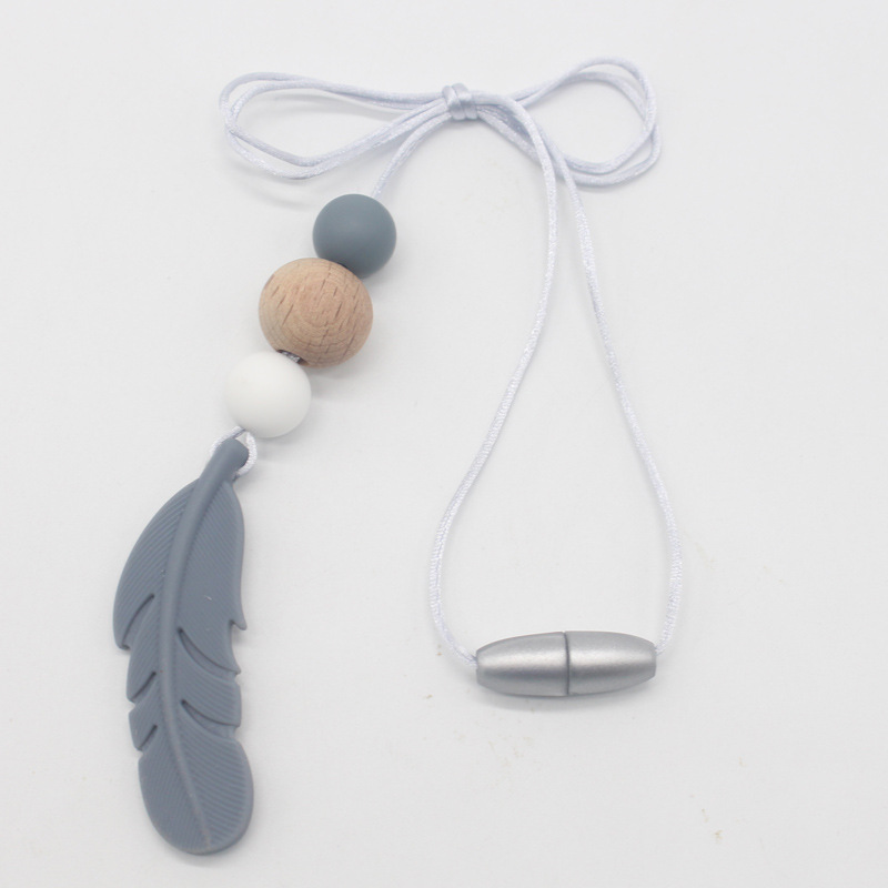 Amazon nueva pluma mordedor collar bebé calmante molar silicona seguridad ambiental Beech bead collar