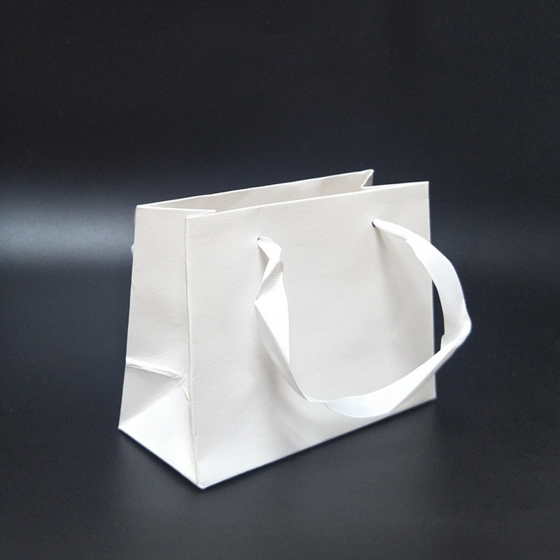 Bolso de regalo de papel Kraft bolso regalo joyería al por mayor accesorios de una pieza de entrega a juego bolsa de embalaje