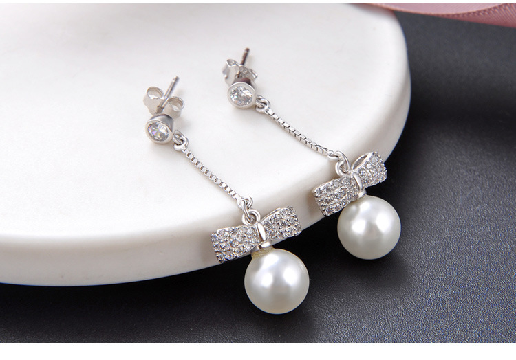 Korean Temperament Bow Micro Inlaid Zircon Pearl S925 Silver Long Earrings display picture 3