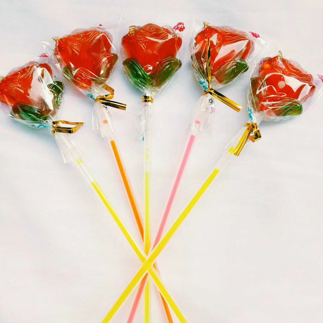 玫瑰花荧光切片棒棒糖手工情人节硬糖儿童零食圣诞节糖果厂家批发