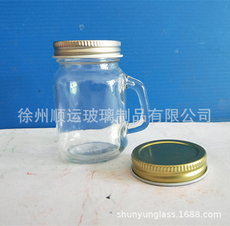 Botellas de bebidas transfronterizas, botellas con forma de lata de alto valor, vasos con asa, botellas de vidrio transparentes, vasos Mason, vasos luminosos, vasos con forma de pollo al por mayor.