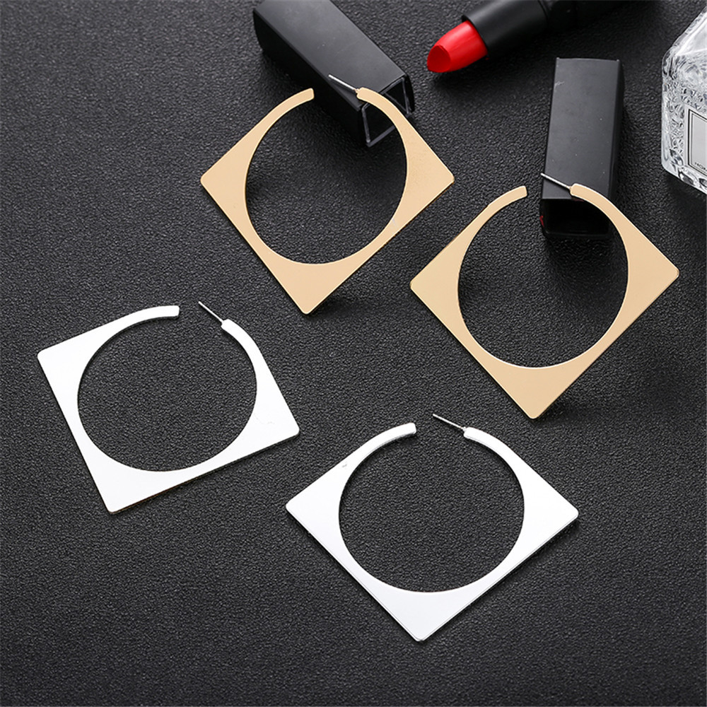 Diamond-shaped gold and silver geometric earrings