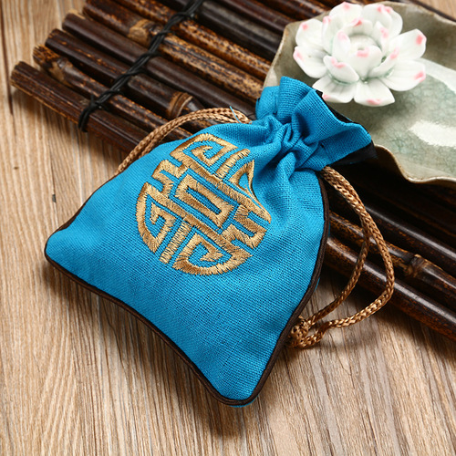 Drawstring-tied jute pouch for jewelry, accessories, gifts, and embroidered bracelet storage