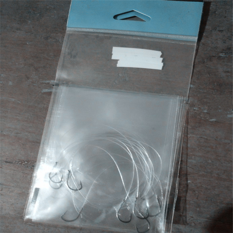 湖南鱼钩封口包装袋枕头袋子透明OPP/pe卡头珠光膜自粘袋打三角孔