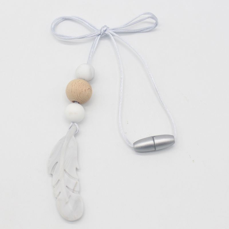 Amazon nueva pluma mordedor collar bebé calmante molar silicona seguridad ambiental Beech bead collar