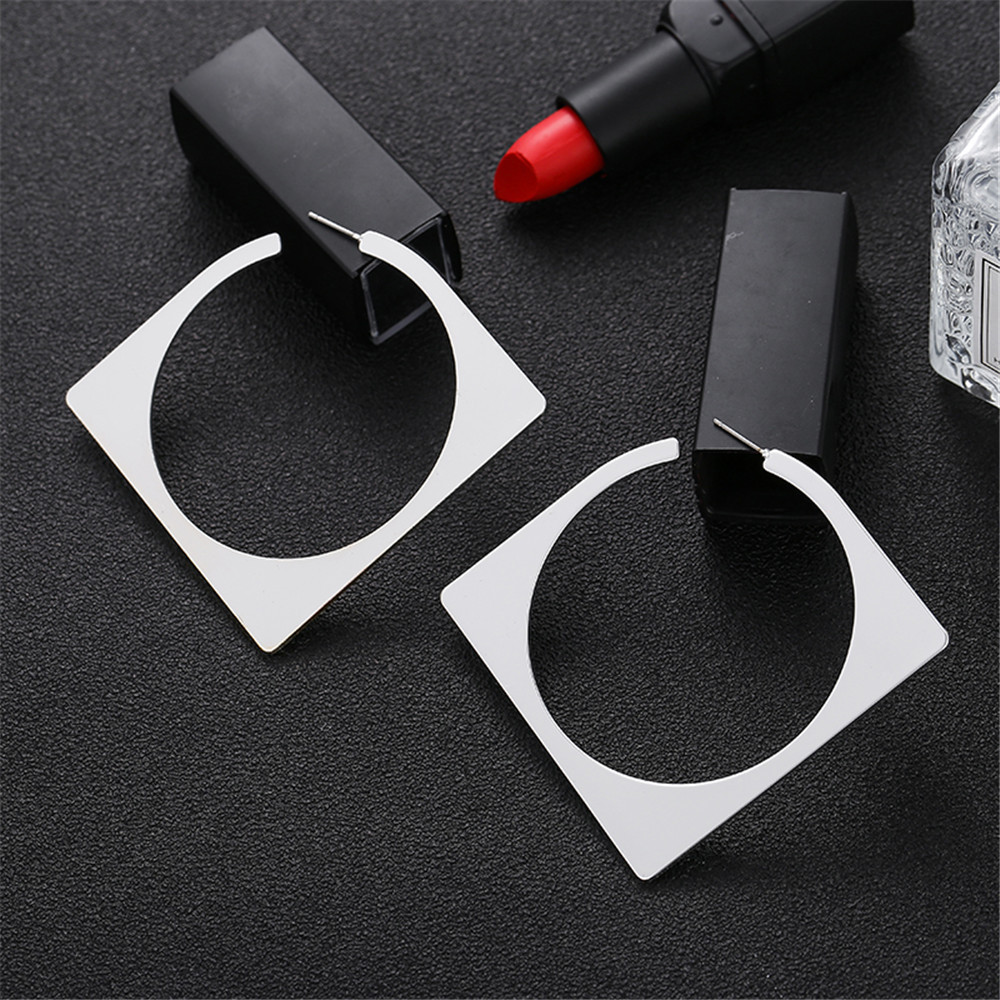 Diamond-shaped gold and silver geometric earrings
