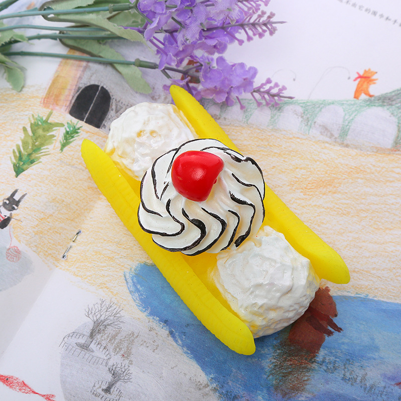 Fábrica al por mayor nuevo perro plátano fruta barco mordedura vinilo juguete mascota molar diente limpieza creativo perro divertido