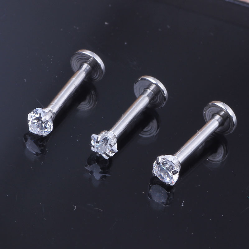 Silver pointed spike labret stud material detail