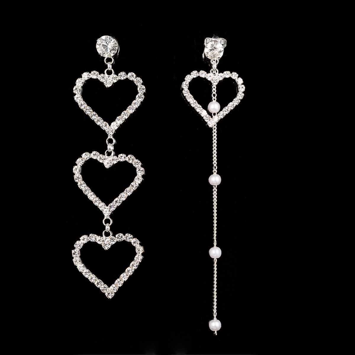 Asymmetrical earrings heart shaped pearl