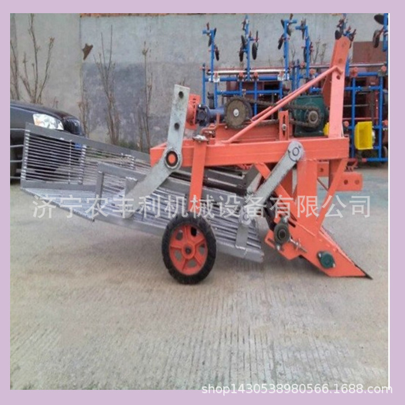 四轮拖拉机牵引式花生收获机小型家用花生收获机图片