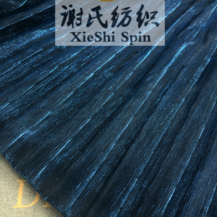 2023夏电光布料 孔雀蓝色电光大百褶网纱面料 透视夜店装压皱布料