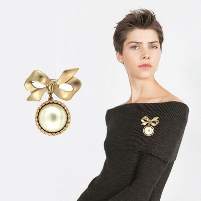 Light gold bow Big pearl Brooch wholesale Qingdao Galaxy Occident fashion Sternum Clothing Pin