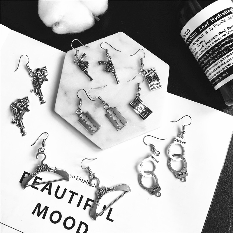 Exaggerated Pistol Plating Alloy No Inlaid Earrings display picture 1