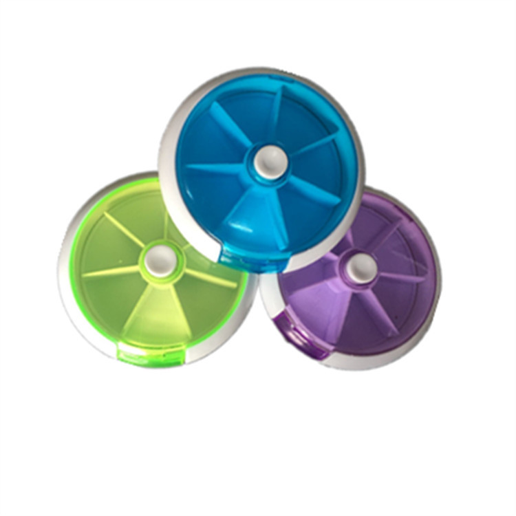 Creativo redondo una semana siete rejilla giratoria píldora Caja 7 días portátil 7 semana rejilla plástico portátil pequeña píldora caja