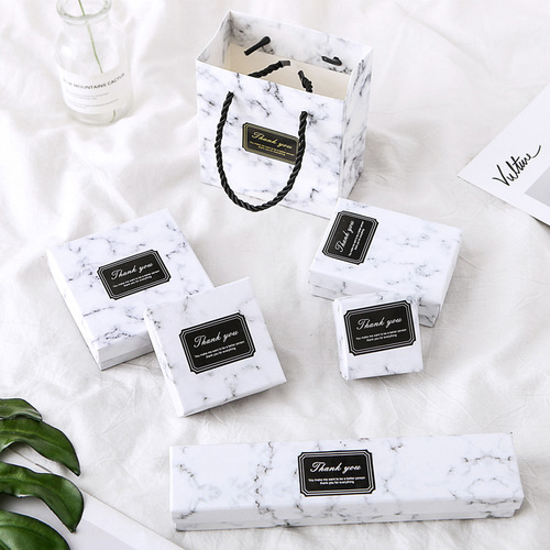 Batch wholesale marble jewelry box with top and bottom covers, rings, earrings, ear studs, bracelets, pearl necklaces, and accessories.