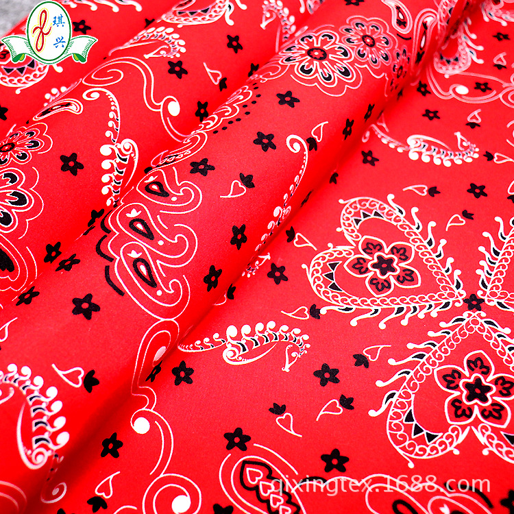 厂家供应梭织布热转移印花沙滩裤面料红色复古印花男士泳裤面料