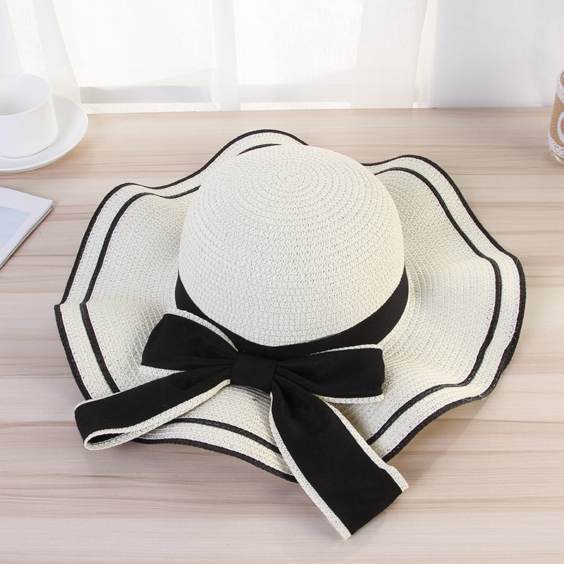 Women's Elegant Pastoral Simple Style Waves Bowknot Big Eaves Straw Hat display picture 3