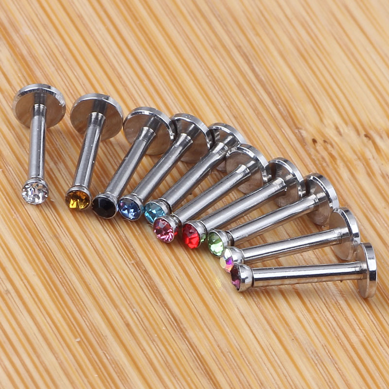 Silver pointed spike labret stud material detail
