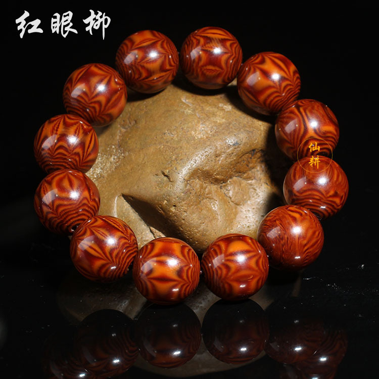 厂家批发高仿紫檀柳对眼手串 蜘蛛纹红眼柳树脂鬼脸圆珠供应