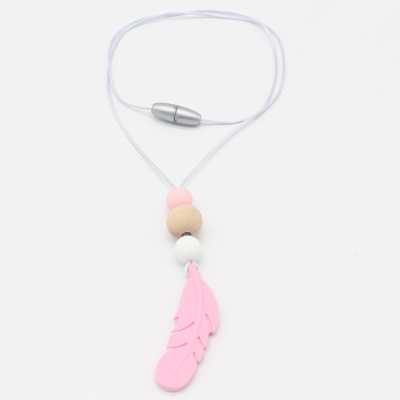 Amazon nueva pluma mordedor collar bebé calmante molar silicona seguridad ambiental Beech bead collar