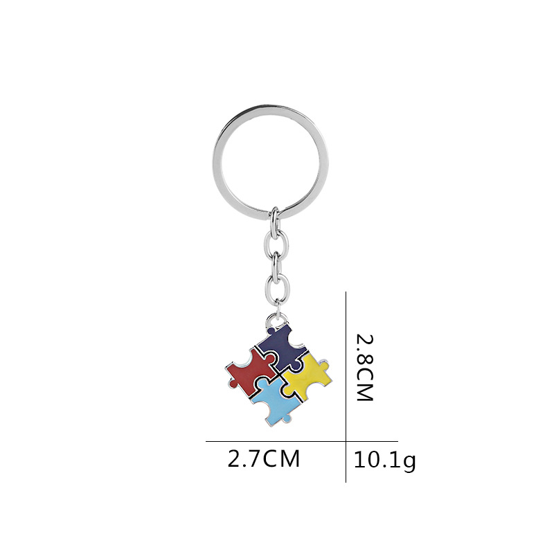 Fashion Explosion Key Chain Children's Four-color Puzzle Drip Oil Key Chain Small Pendant Jewelry Wholesale Nihaojewelry display picture 1