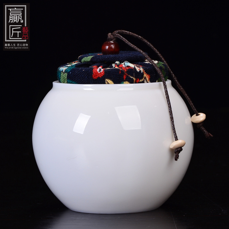 Winjiang blanco porcelana sellada tarro de té Corcho de cerámica sellado tarro pequeño tamaño Pu'er almacén de té ovejas grasa Jade porcelana tarro de té