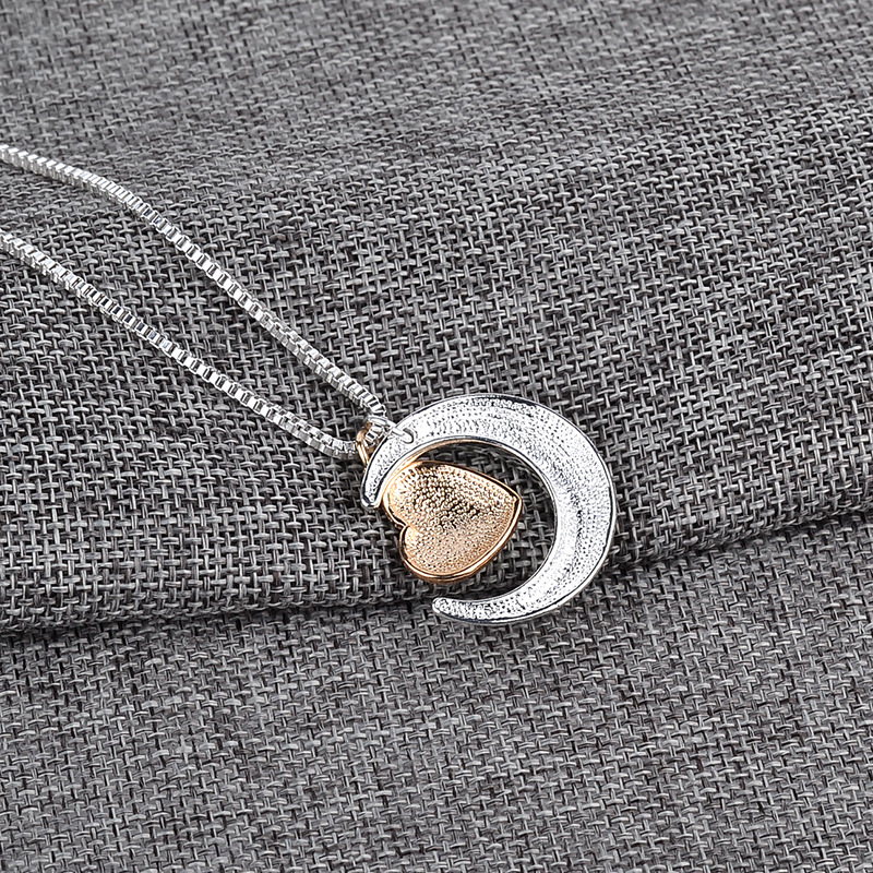 This exquisite sterling silver necklace is a thoughtful gift for the special mother in your life. Crafted with intricate detail, the To The Moon & Back, Heart Mother's Day Necklace is a timeless symbol of your cherished relationship. A perfect way to express your admiration and love.