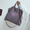 Capacious bag strap one shoulder with letters, with embroidery
