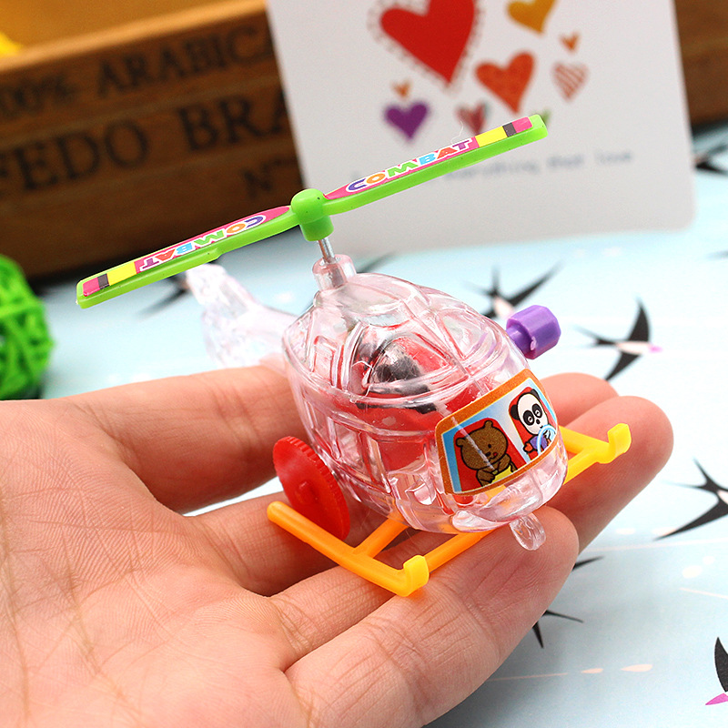 New winding transparent small aircraft plastic helicopter taxiing with propeller rotatable toys wholesale