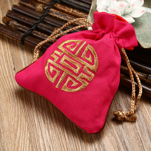 Drawstring-tied jute pouch for jewelry, accessories, gifts, and embroidered bracelet storage