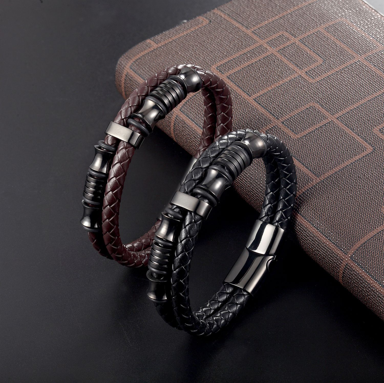 Cross-border hot sale titanium steel leather woven bracelet personality men's stainless steel gun black magnet buckle bracelet jewelry wholesale