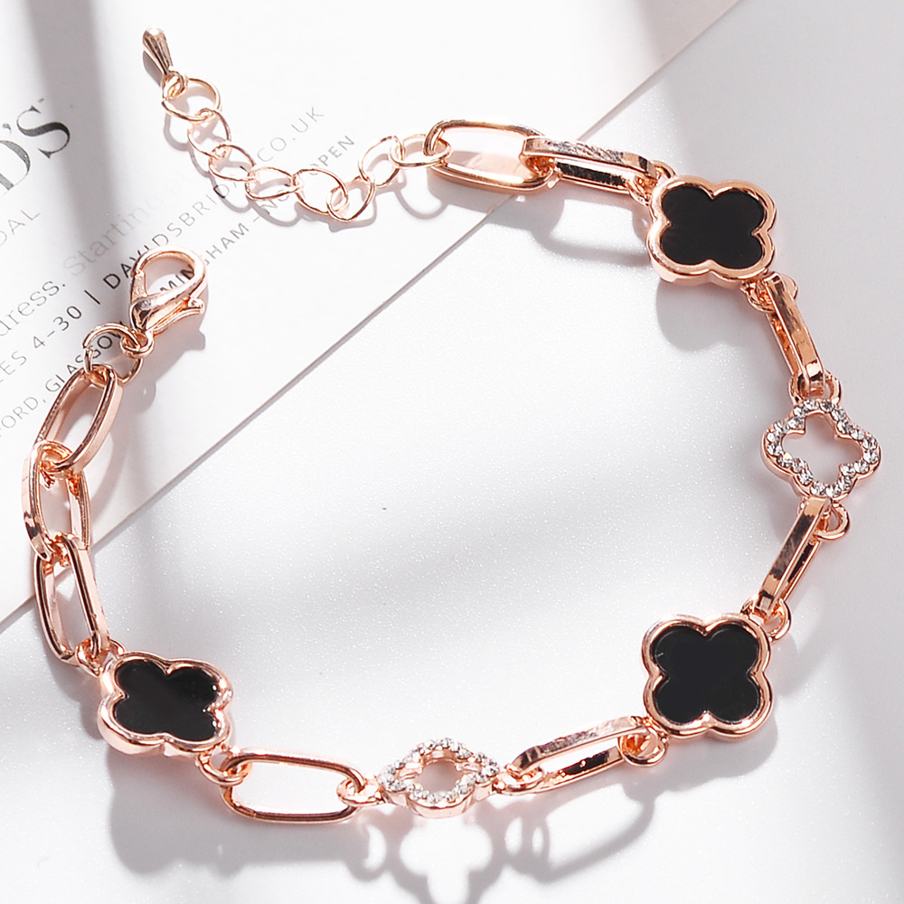 Flor trébol de cuatro hojas pulsera versión coreana de la pulsera de cristal señoras joyería hechizo reloj regalo negro diamante flor uno