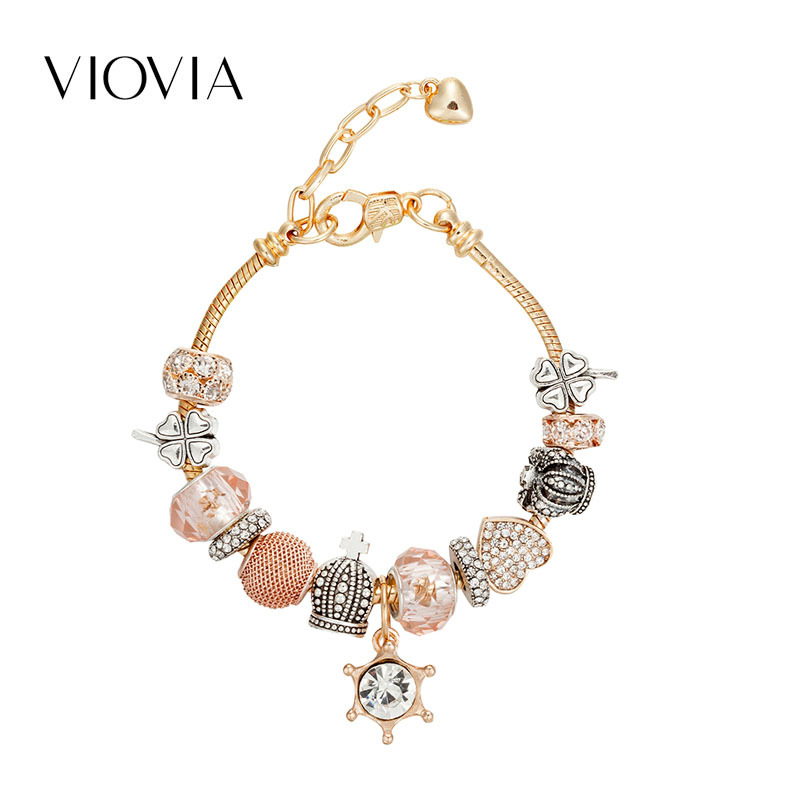 Bracciale charm con pendente a forma di timone e diamanti_voghion.com