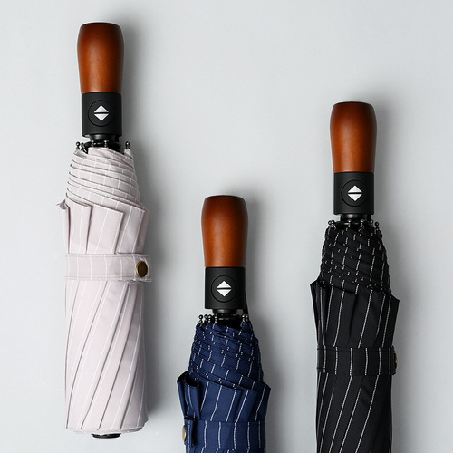 Fully automatic solid wood handle umbrella ten-bone windproof umbrella three-fold fair or rainy folding umbrella men's high-end business advertising umbrella
