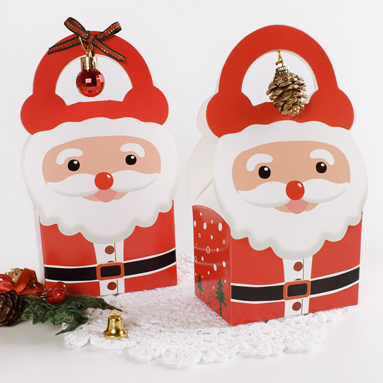 現物サンタクロースがキャンディー紙箱を持って赤いクリスマスハロウィーン専用キャンディープレゼント包装箱を卸売りする|undefined