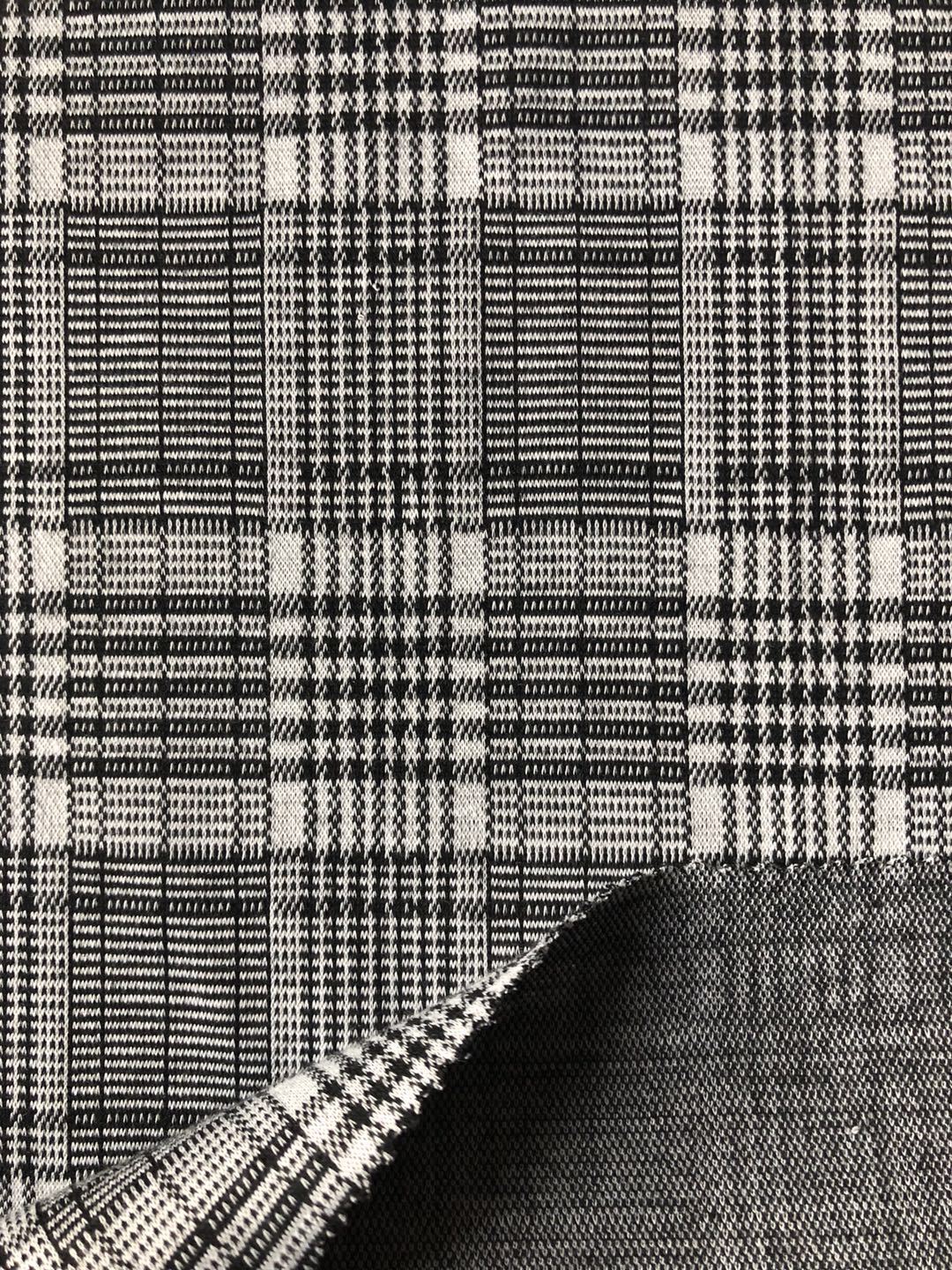 供应针织细针提花 黑白千鸟格提花面料 秋冬外套格子提花面料
