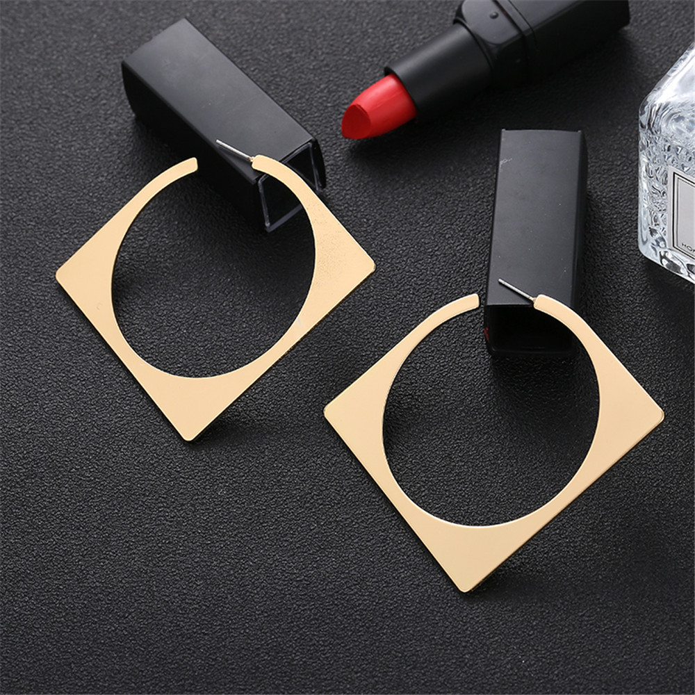 Diamond-shaped gold and silver geometric earrings