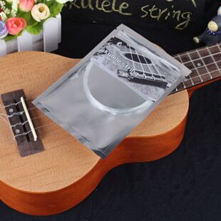 Bagged imitation carbon ukulele suit strings transparent nylon ukulele strings universal small guitar strings