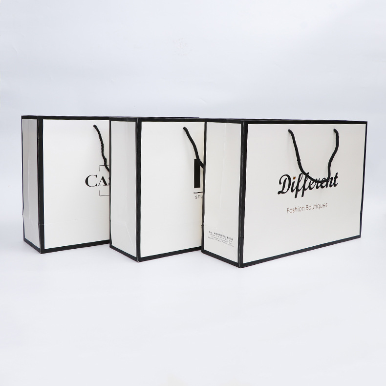 生产供应白底黑边礼品手提纸袋 服装店通用白卡包装购物袋 定做