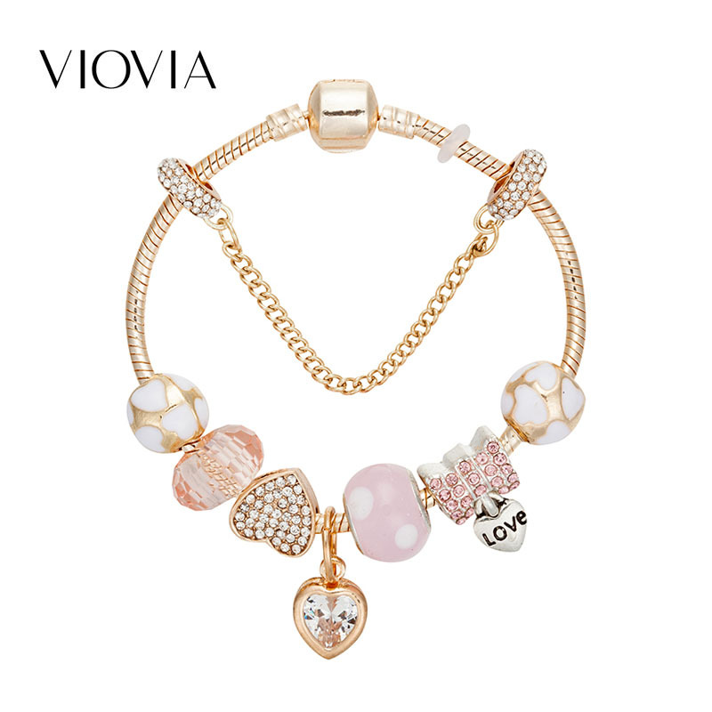 Bracciale charm oro con pendente a cuore e strass in lega_voghion.com