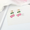 Fuchsia universal brand golden metal earrings heart-shaped