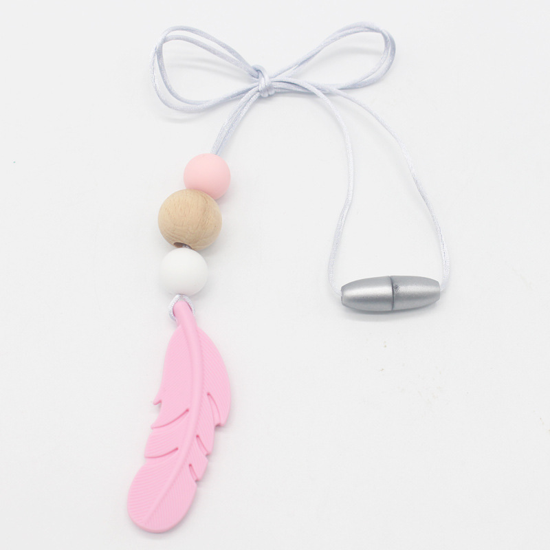 Amazon nueva pluma mordedor collar bebé calmante molar silicona seguridad ambiental Beech bead collar