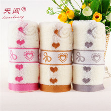全棉吸水柔软毛巾面巾 无捻桃心蝴蝶结提花毛巾 家居日用时尚毛巾