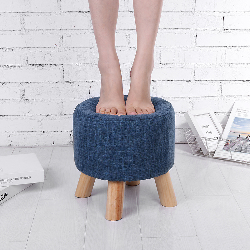 Suministro de fábrica creativo Cambio de zapatos taburete bajo taburete de cuatro patas extraíble y lavable hogar diario taburete Lino taburete redondo taburete de madera maciza