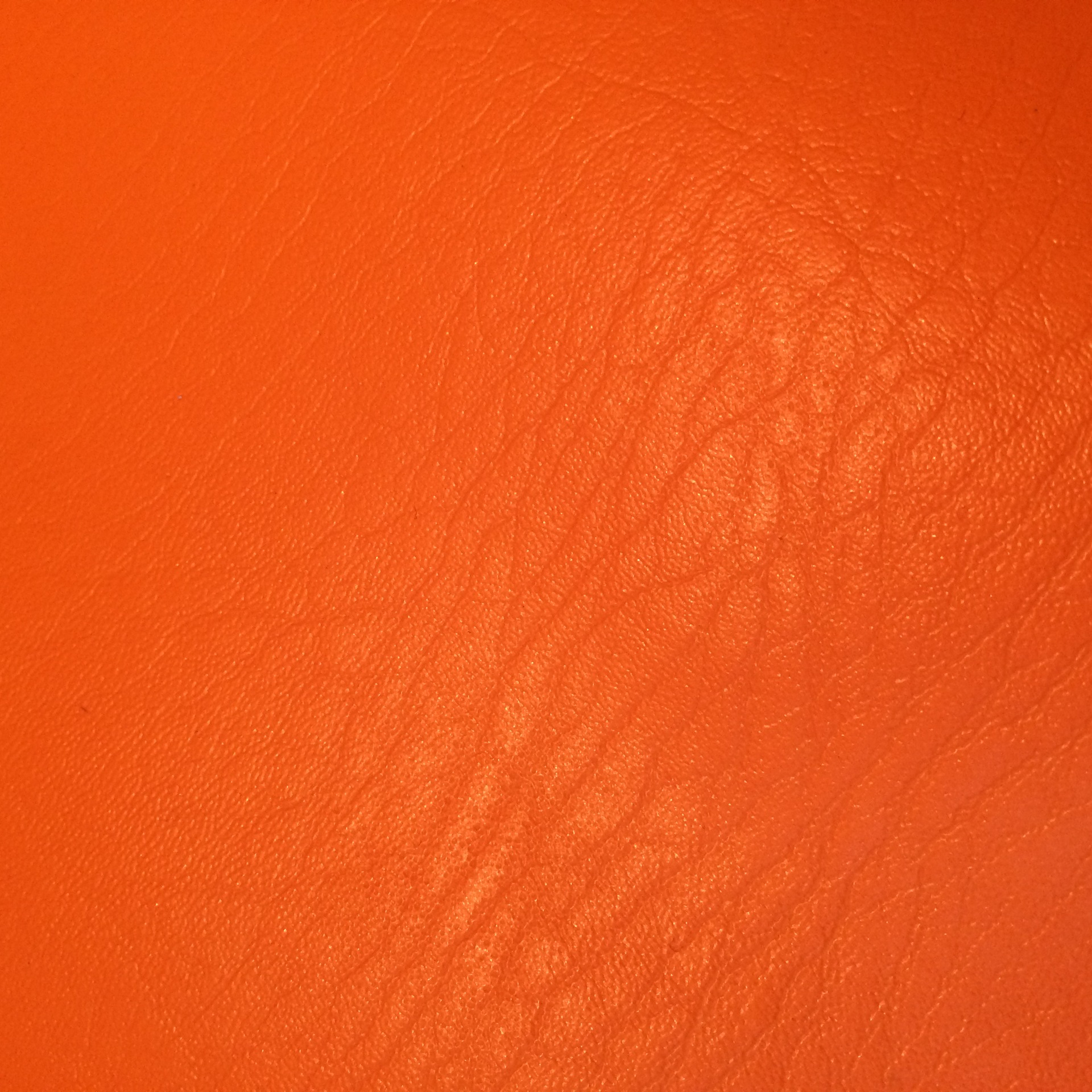 少量现货供应箱包相框包装用桔黄色大象纹0.5厚水刺底义乌皮